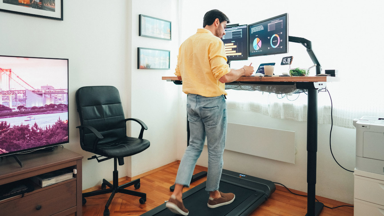 Person on a standing desk with a walking pad